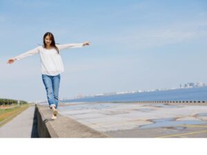 a-woman -walks-on -the-pierNG